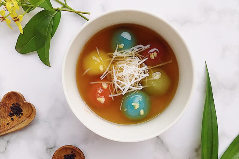 Colored floating rice cake with coconut milk
